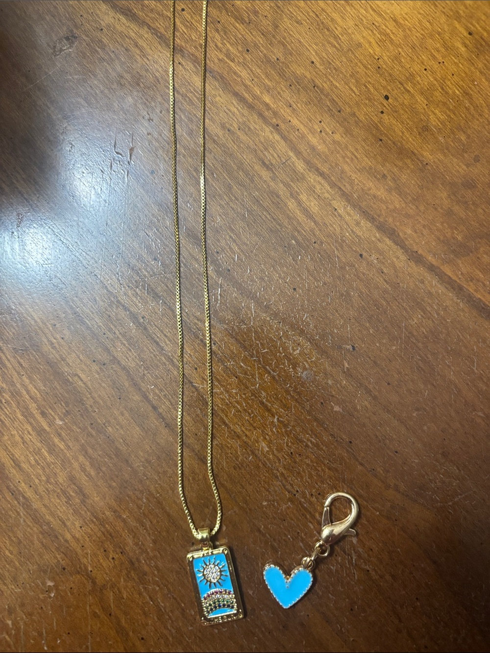 Gold-Tone Blue Sunburst Enamel Pendant Necklace with extra heart pendant.